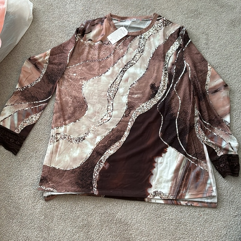 We are selling 2 women’s XXL shirts for $30 each. Material is light dry fit.